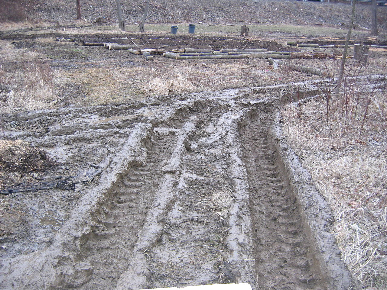 1280px-Muddy_tractor_ruts_001.jpeg